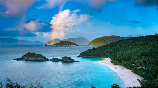 A woman and a horse walking beside a rail fence in a rural U.S. location.